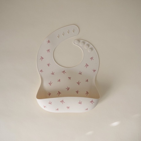 Mushie Śliniak Silikonowy z kieszonką - Kokardki